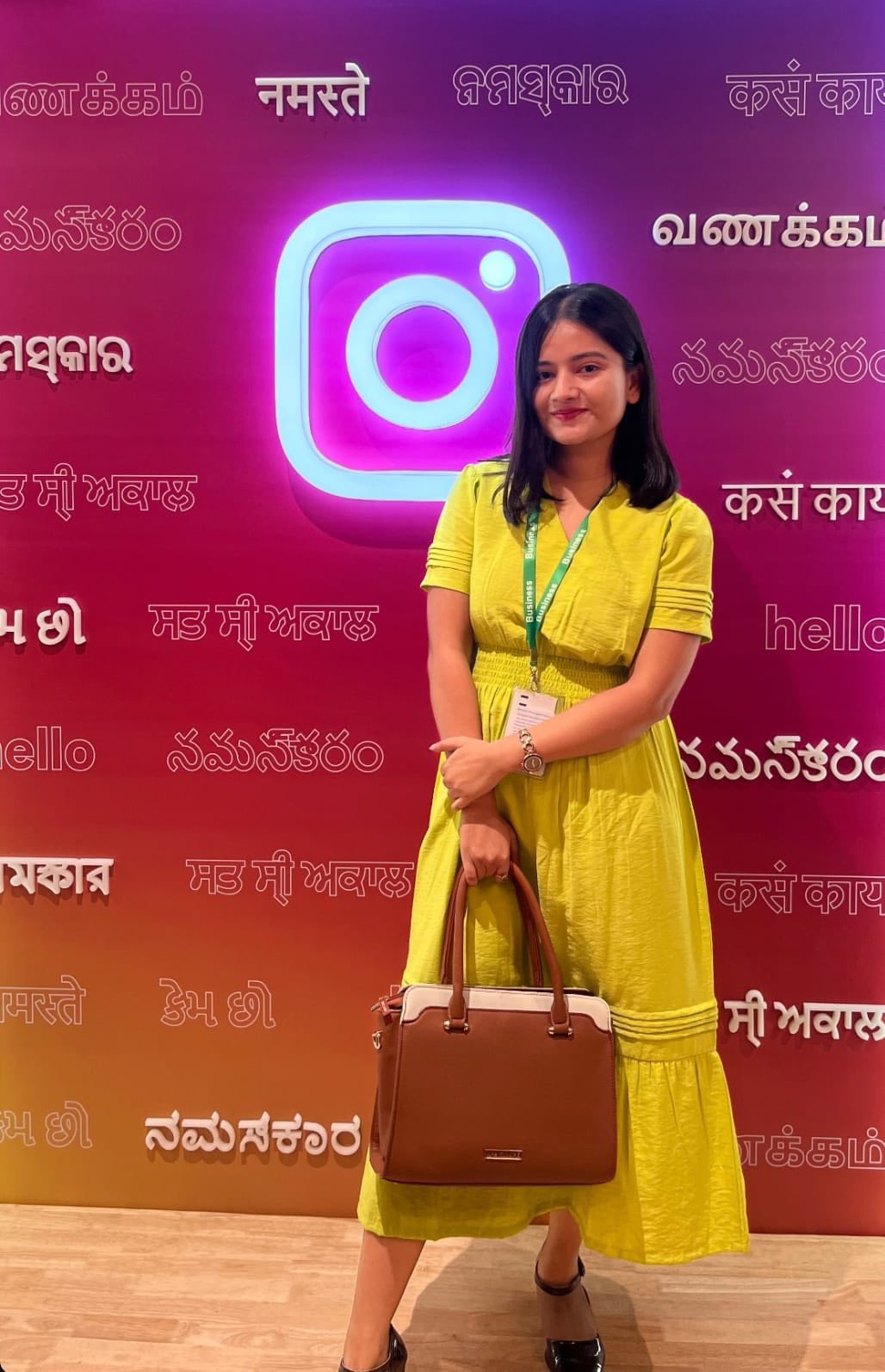 RJ Priyanka posing in studio wearing headphones, smiling confidently