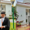 Naziz Afruz, law graduate and newly inducted Bar Council member, in formal attire outside Gauhati High Court.