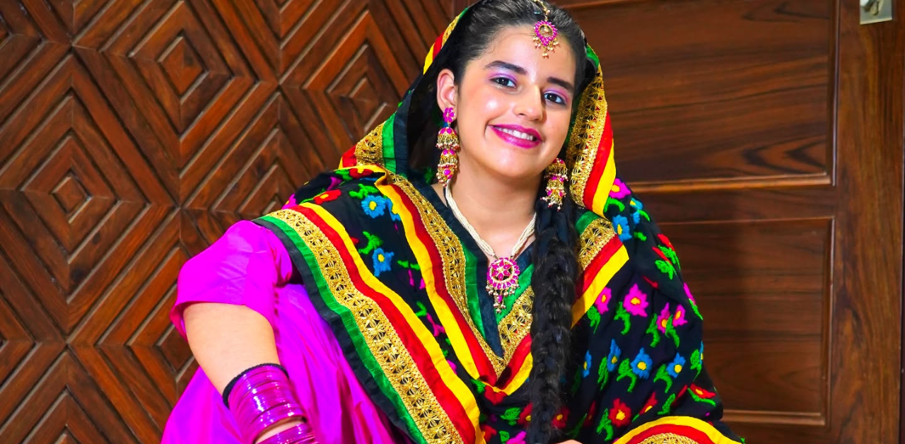 Dilnoor Sanghera performing a modern dance move in stylish outfit