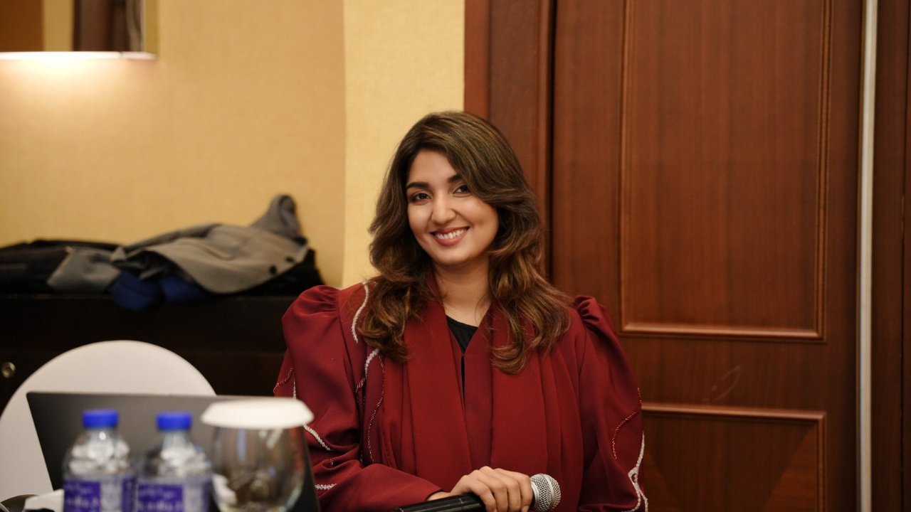 Dr. Iqra Hussain Shaikh presenting biryani at her restaurant in Oman